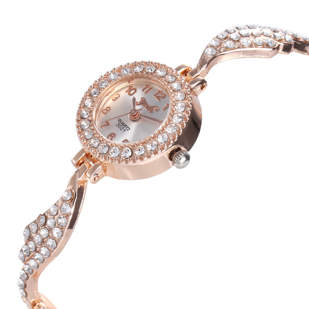 Wish new ladies alloy watch ladies fashion full diamond wing bracelet bracelet quartz watch on behalf of